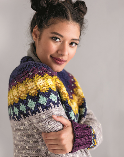 Modeled photo of the Yukon Jacket from The Colorwork Bible, demonstrating stranded colorwork knitting.